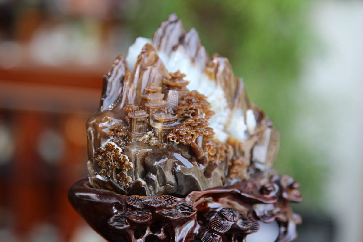 ATELIER 002 · Multi-Colour — nephrite jade carving, on the hand