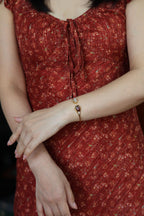 ATELIER 004 · Caramel — nephrite jade bangle, on the model