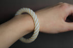 ATELIER 005 · Suet White — nephrite jade bangle, on the wrist