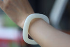 ATELIER 006 · Suet White — nephrite jade bangle, on the model