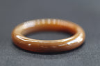 ATELIER 007 · Caramel — nephrite jade bangle, close view
