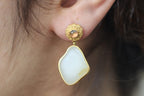 ATELIER 008 · Suet White — nephrite jade earrings, on the model, close