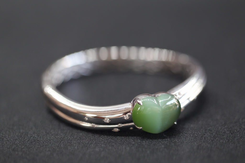 ATELIER 010 · Cat's Eye — nephrite jade bangle & ring set, bangle, angled view