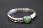 ATELIER 010 · Cat's Eye — nephrite jade bangle & ring set, bangle, angled view
