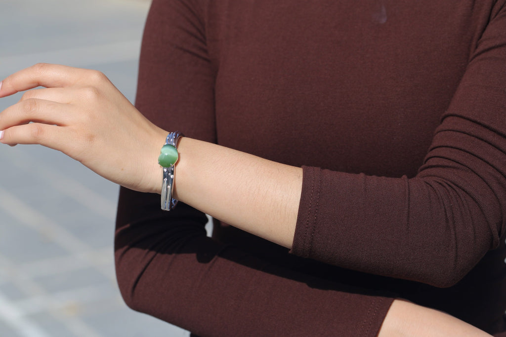ATELIER 010 · Cat's Eye — nephrite jade bangle & ring set, bangle, on the wrist, alternate view