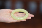 ATELIER 012 · Golden Green — nephrite jade round bangle, close view