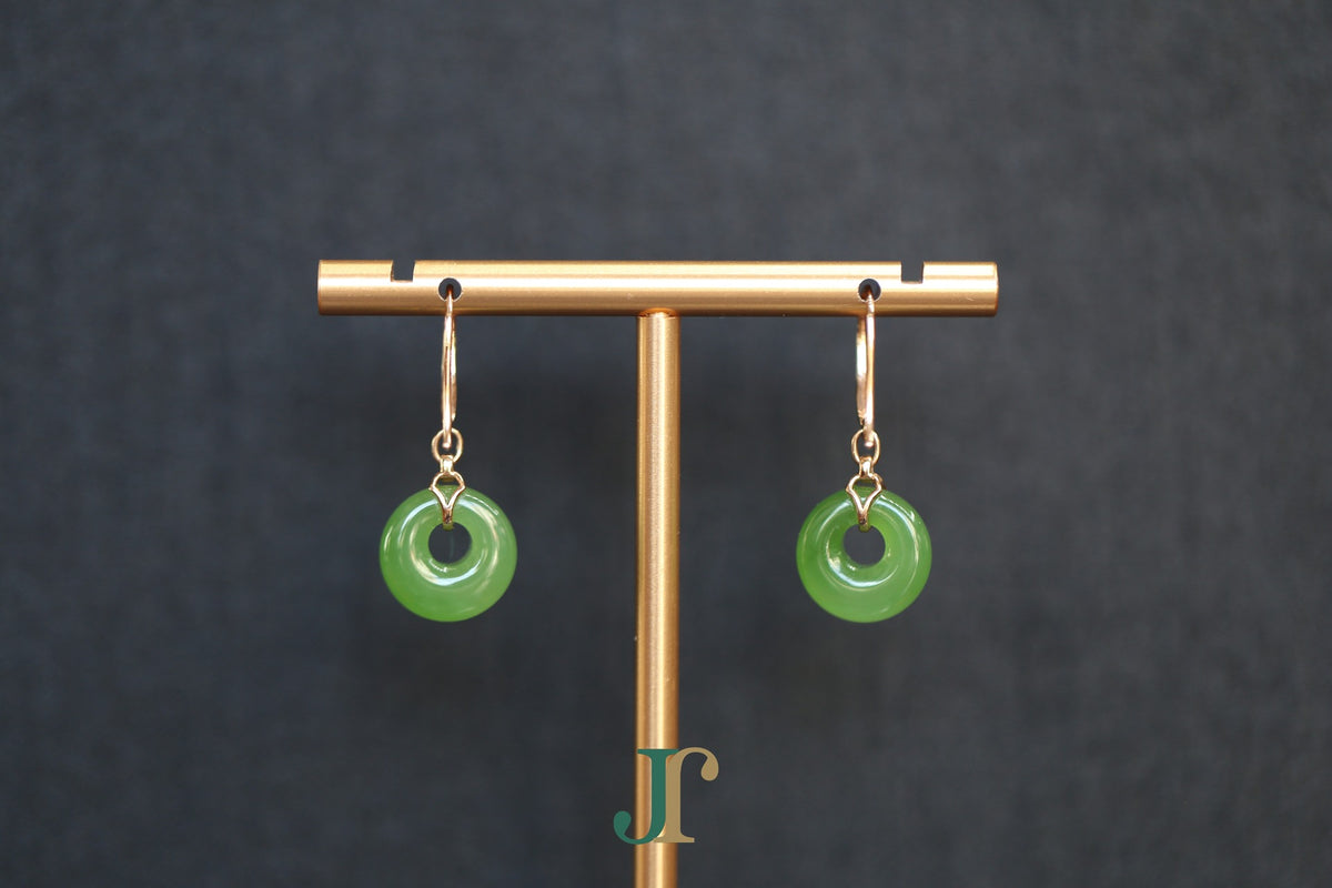 ATELIER 024 · Willow Green — nephrite jade earrings, on a display stand