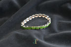 ATELIER 025 · Spinach Green — nephrite jade bracelet, side view