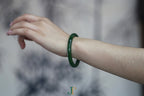 ATELIER 027 · Spinach Green — nephrite jade round bangle, on the model