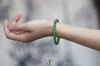 ATELIER 028 · Willow Green — nephrite jade round bangle, on the wrist
