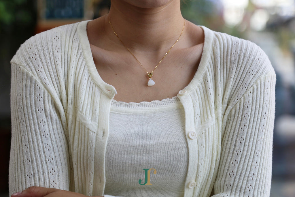 ATELIER 033 · Suet White — nephrite jade pendant, worn