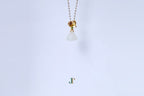 ATELIER 033 · Suet White — nephrite jade pendant, hanging view
