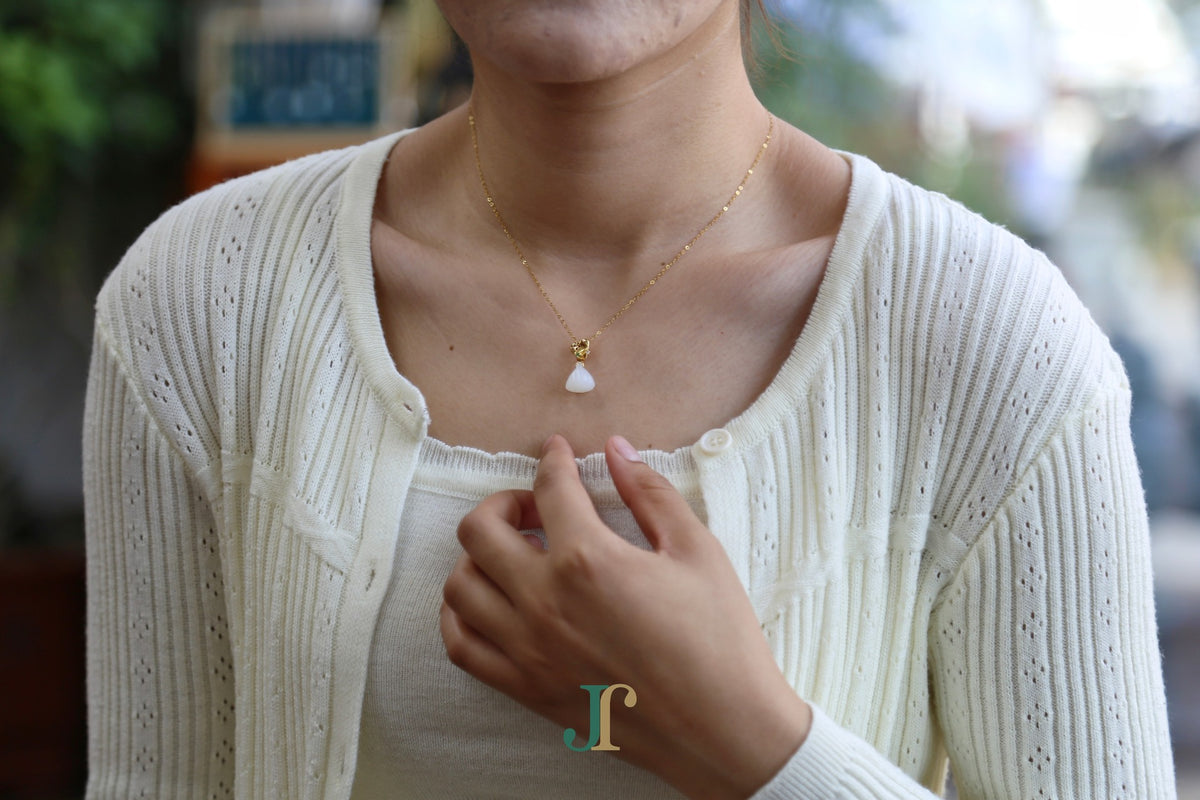 ATELIER 033 · Suet White — nephrite jade pendant, on the model