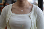 ATELIER 034 · Suet White — nephrite jade pendant, worn