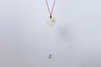ATELIER 034 · Suet White — nephrite jade pendant, hanging view