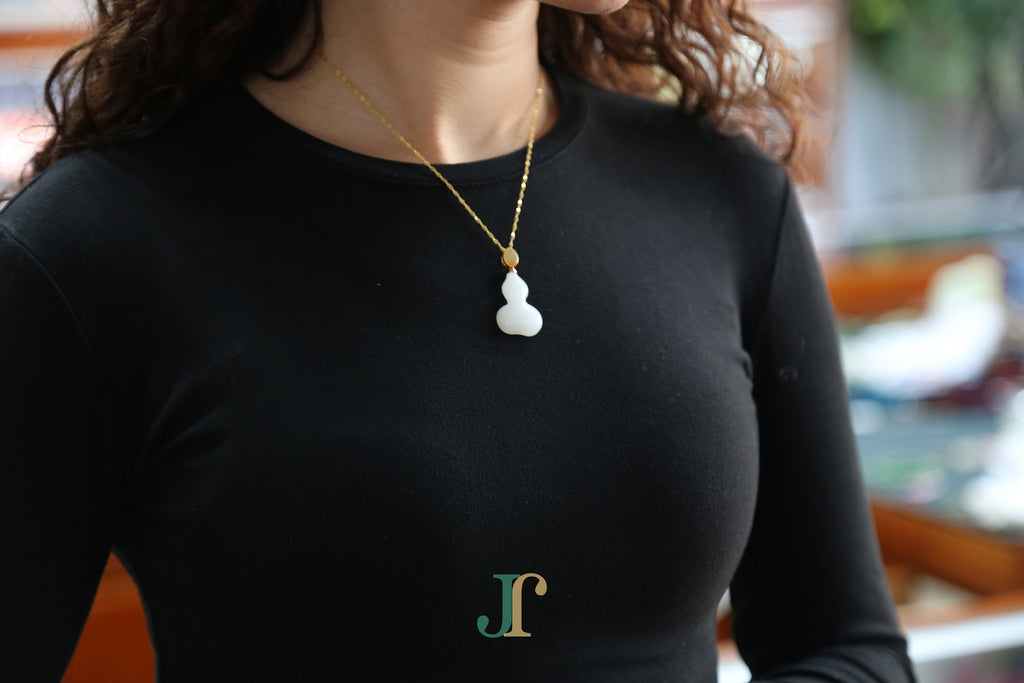 ATELIER 041 · Suet White — nephrite jade pendant, on the model