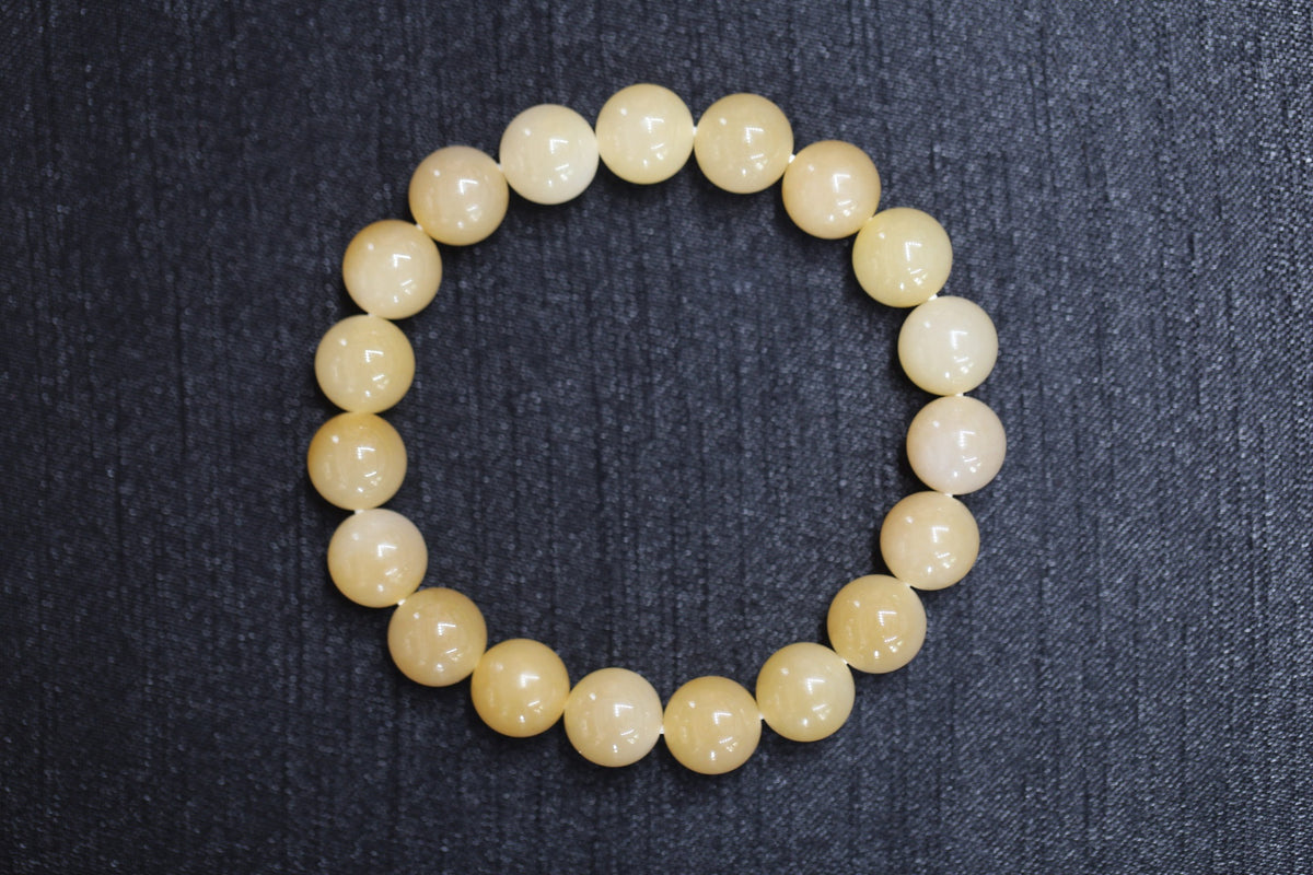 GAIA Earthy 10 · Honey-Amber — nephrite jade bead bracelet, front