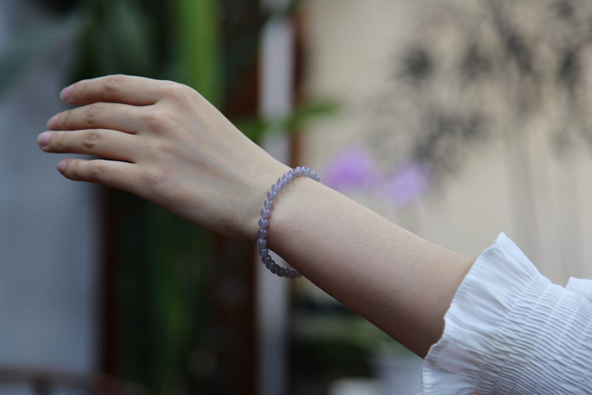 GAIA Earthy 6 · Smoky Lilac — nephrite jade bead bracelet, on the wrist