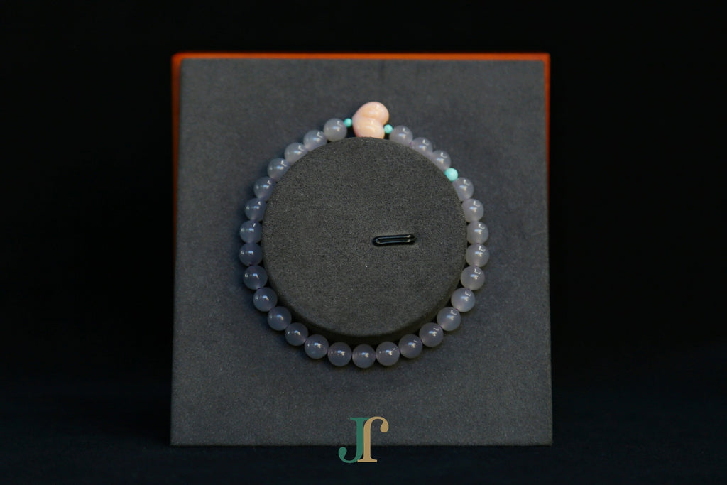 GAIA Earthy 6 Spiritual · Smoky Lilac · Heart — nephrite jade bead bracelet, on a display stand