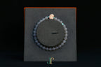 GAIA Earthy 6 Spiritual · Smoky Lilac · Heart — nephrite jade bead bracelet, on a display stand