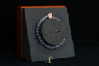 GAIA Earthy 6 Spiritual · Smoky Lilac · Heart — nephrite jade bead bracelet, on a display stand, second view