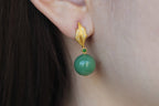 GAIA Leaf 12 · Willow Green — nephrite jade earrings, on the model