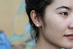 GAIA Luna 8 · Suet White — nephrite jade earrings, on the hand
