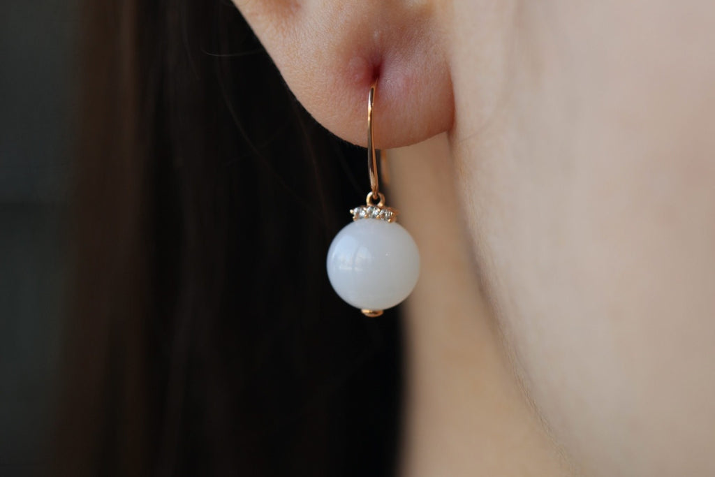 GAIA Luna 10 · Suet White — nephrite jade earrings, on the model