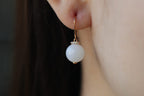 GAIA Luna 10 · Suet White — nephrite jade earrings, on the model