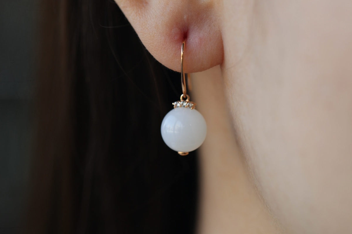 GAIA Luna 10 · Suet White — nephrite jade earrings, on the model