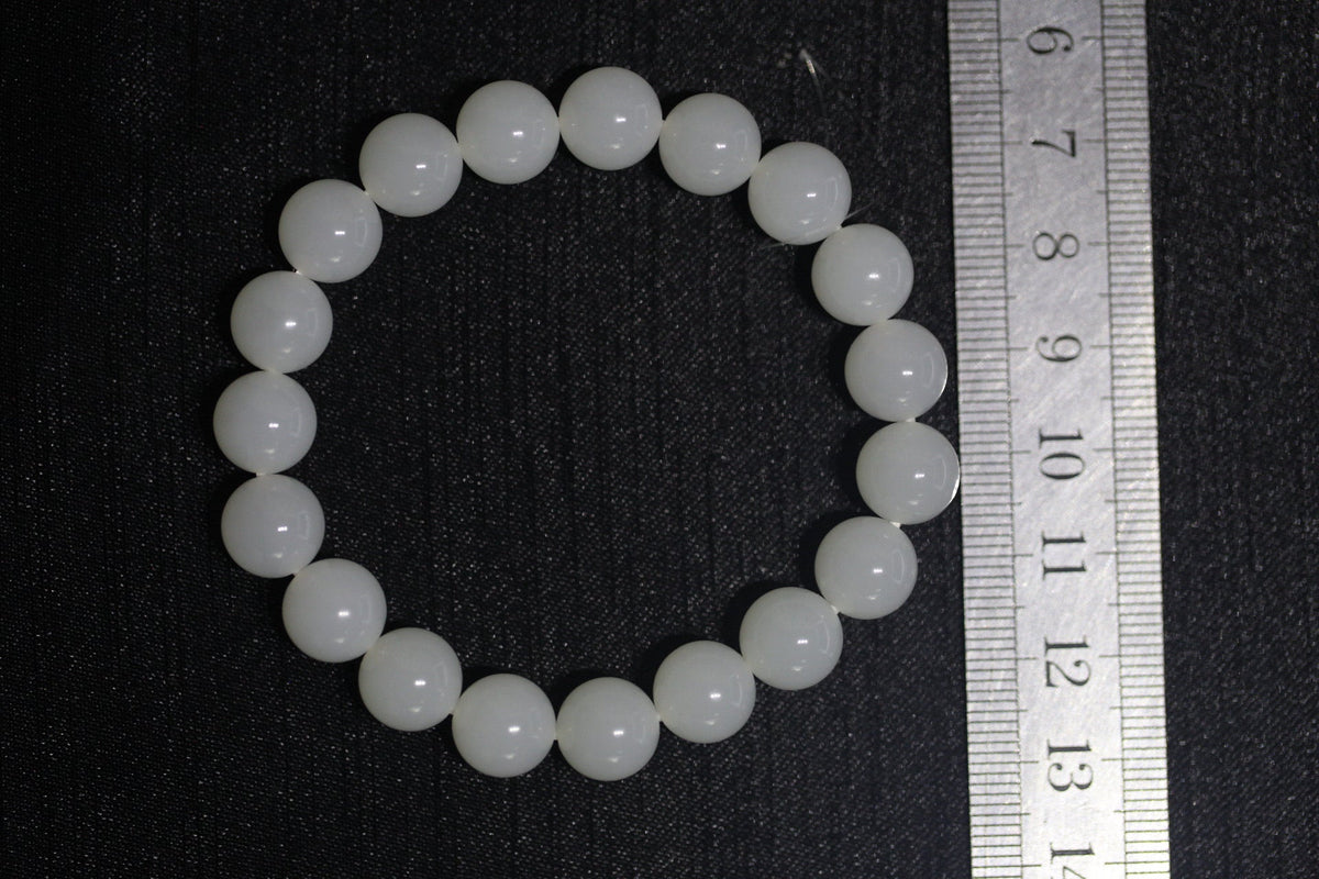 GAIA Earthy 10 · Suet White — nephrite jade bead bracelet, size reference