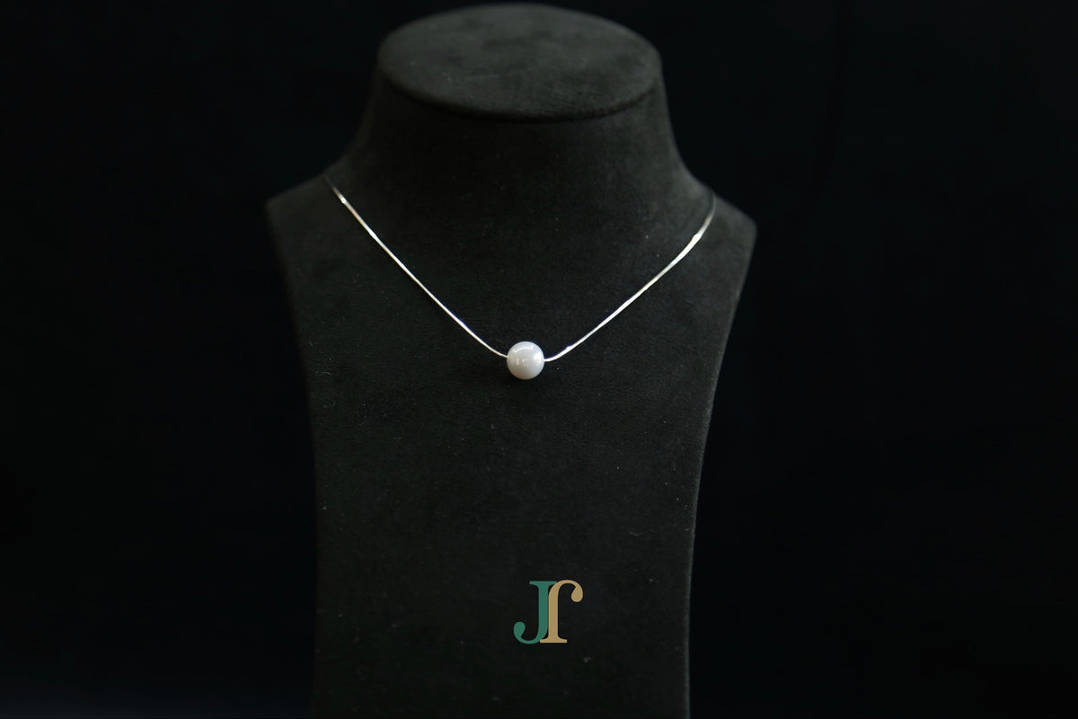 GAIA Pure 10 · Smoky Lilac — nephrite jade bead necklace, on a display bust