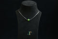 GAIA Pure 10 · Spinach Green — nephrite jade bead necklace, on a display bust