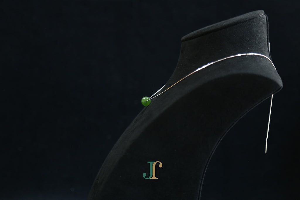 GAIA Pure 10 · Spinach Green — nephrite jade bead necklace, on a display bust, side view