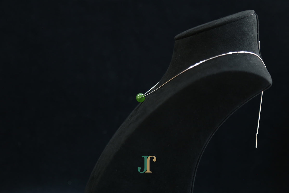 GAIA Pure 10 · Spinach Green — nephrite jade bead necklace, on a display bust, side view