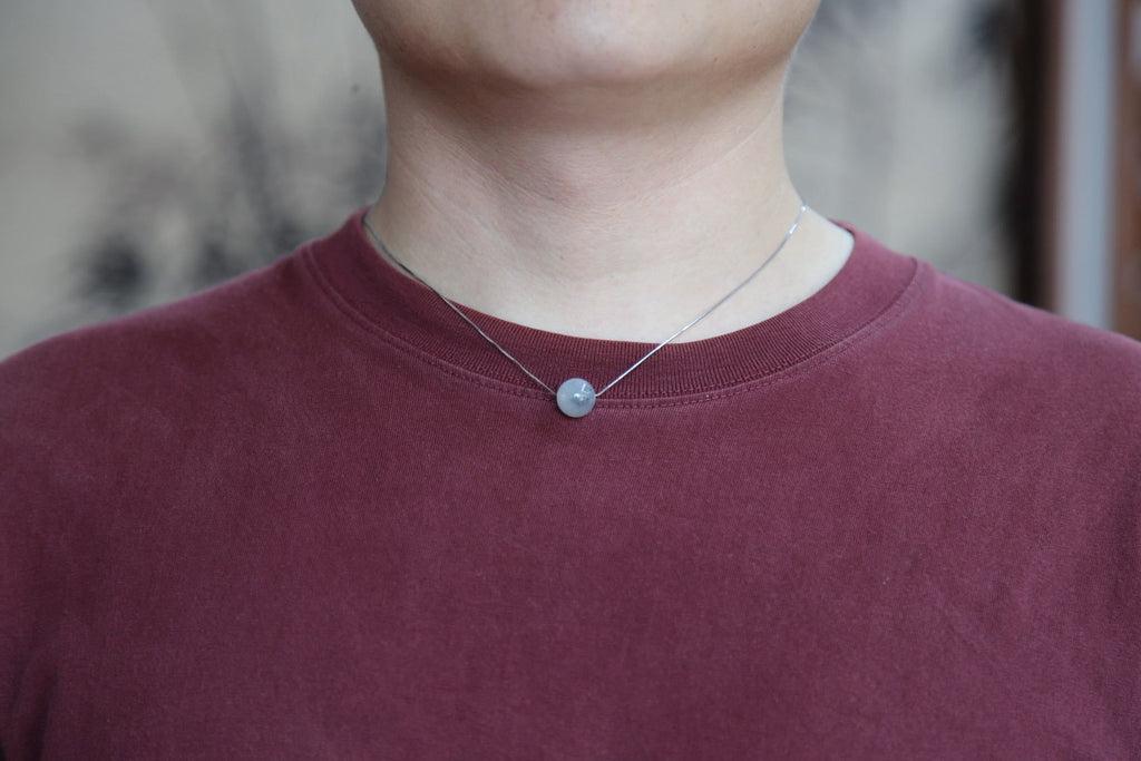 GAIA Pure 12 · Ink Wash — nephrite jade bead necklace, on the hand