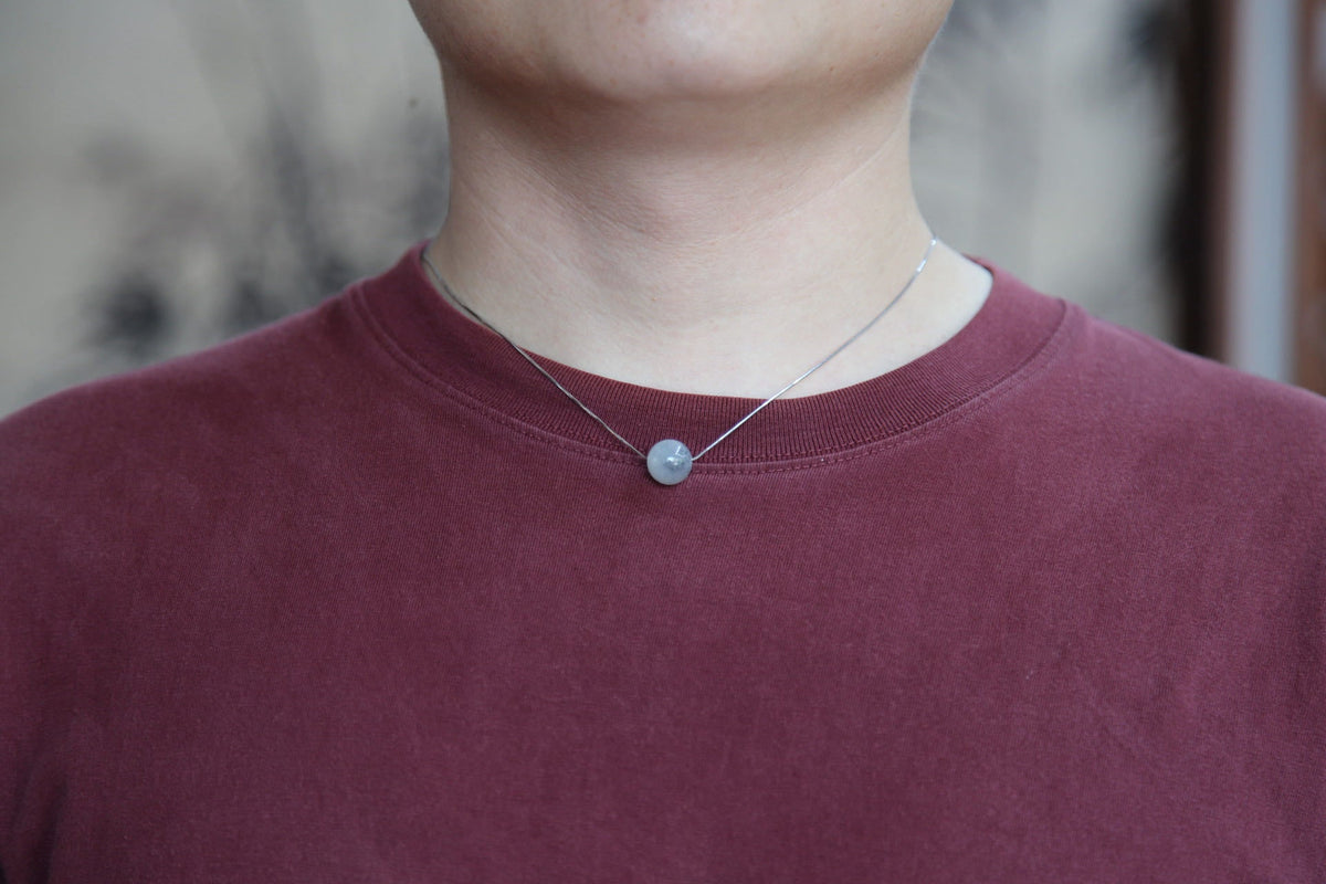 GAIA Pure 12 · Ink Wash — nephrite jade bead necklace, on the hand