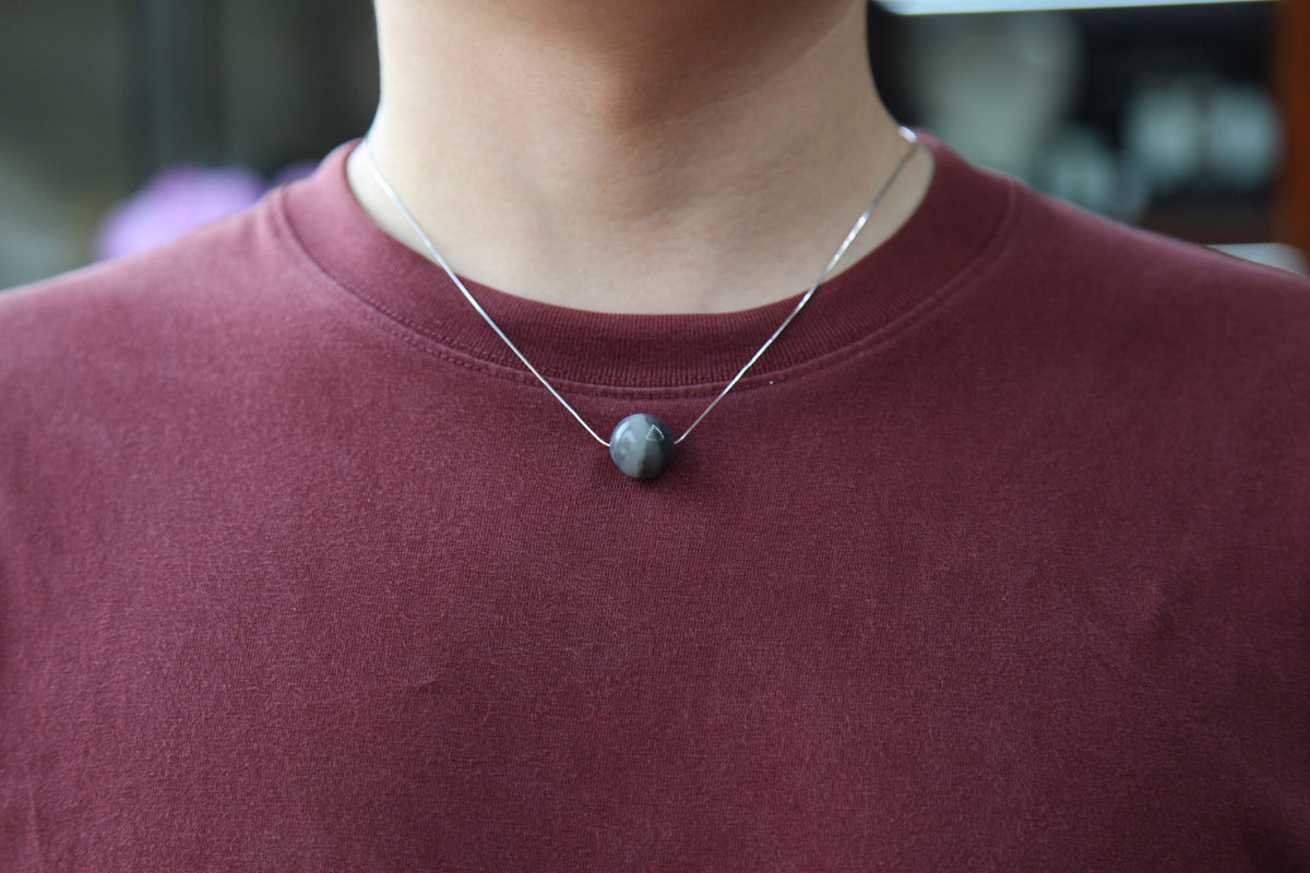 GAIA Pure 15.8 · Ink Wash — nephrite jade bead necklace, on the hand