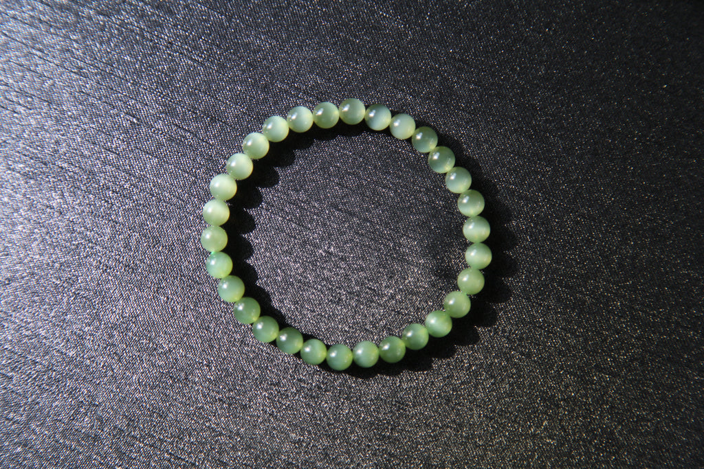 GAIA Earthy 6 · Cat's Eye — nephrite jade bead bracelet, on the model