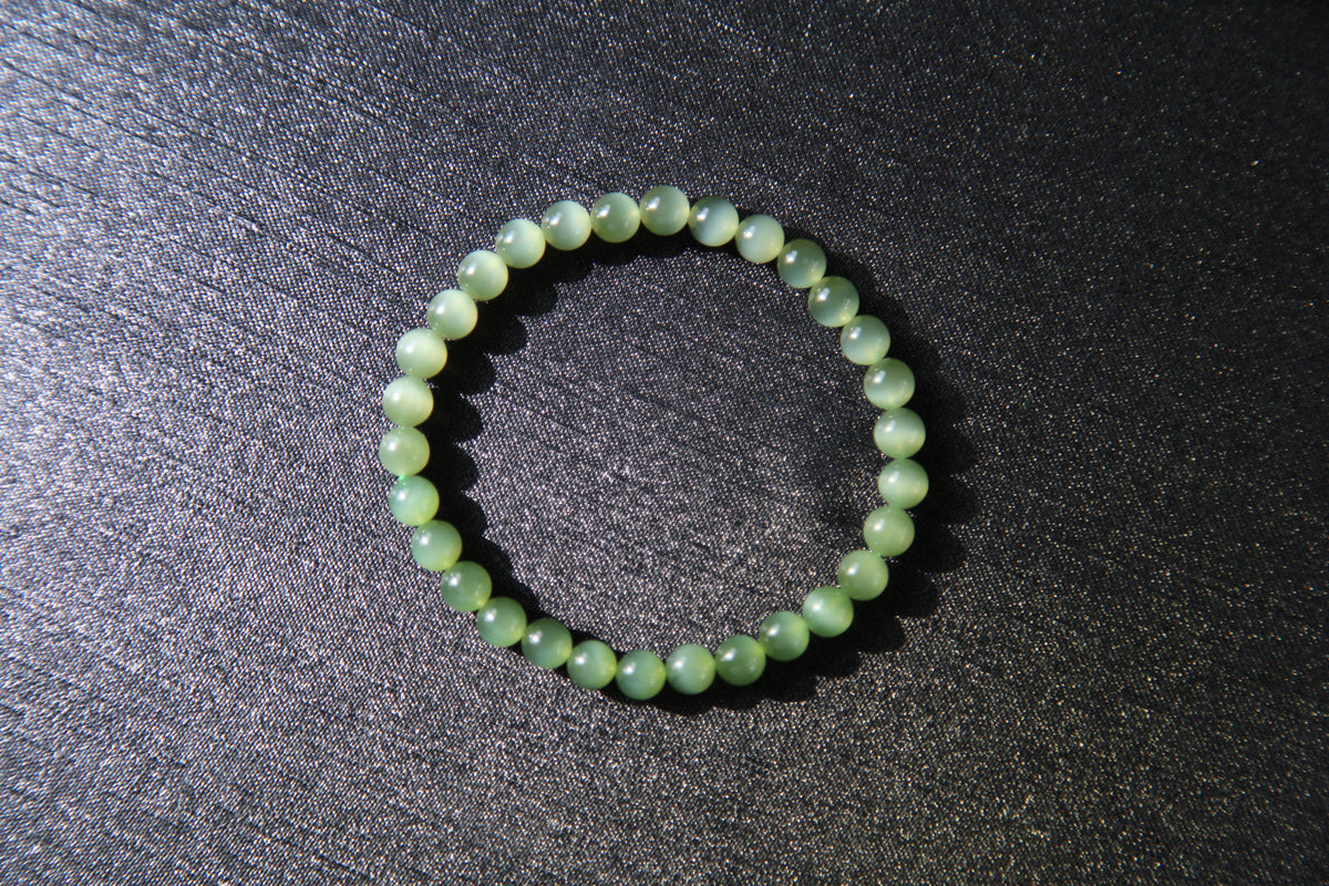 GAIA Earthy 6 · Cat's Eye — nephrite jade bead bracelet, on the model