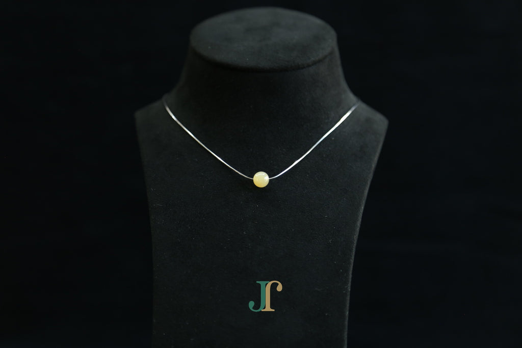 GAIA Pure 8 · Honey-Amber — nephrite jade bead necklace, on a display bust