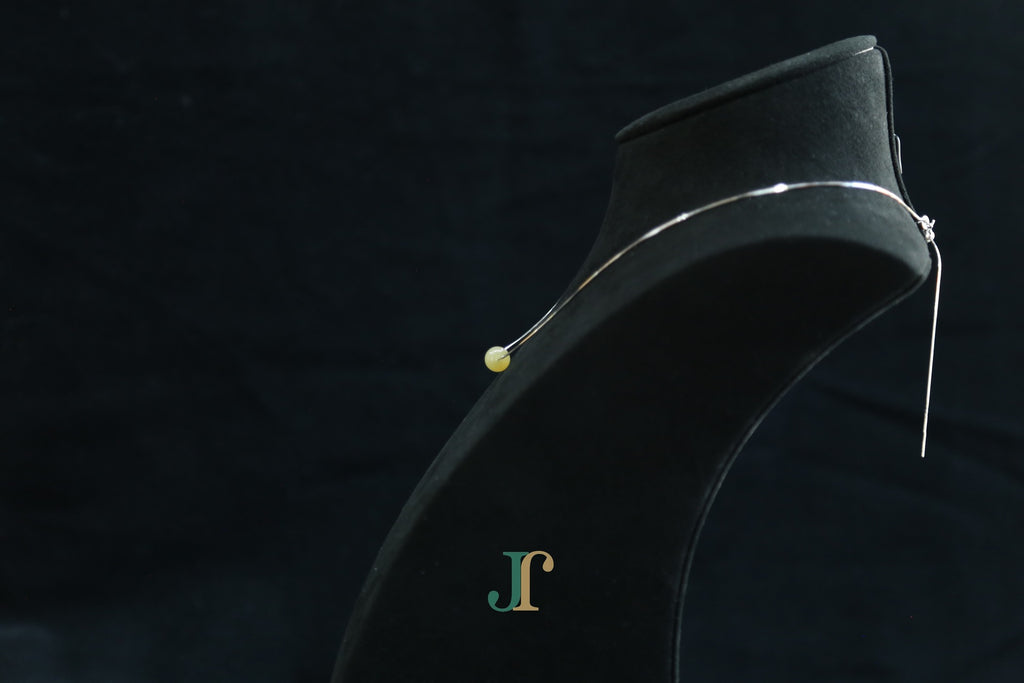 GAIA Pure 8 · Honey-Amber — nephrite jade bead necklace, on a display bust, side view