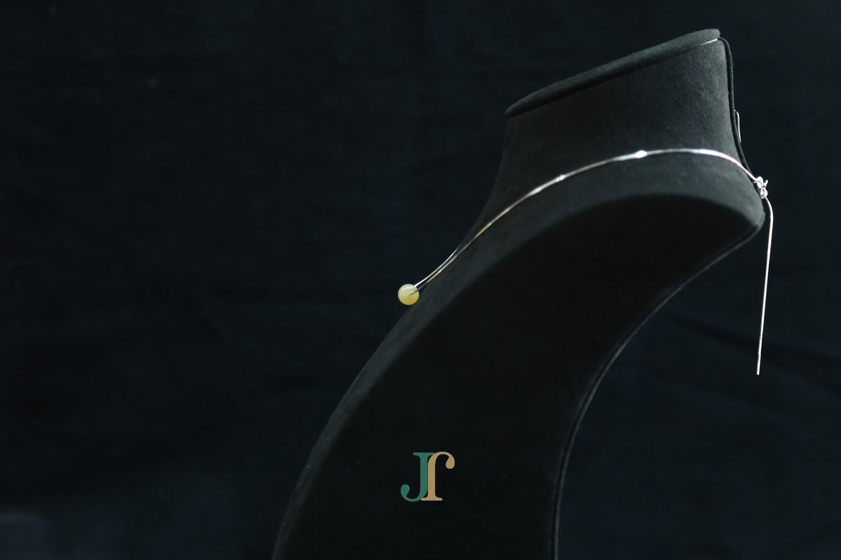 GAIA Pure 8 · Honey-Amber — nephrite jade bead necklace, on a display bust, side view