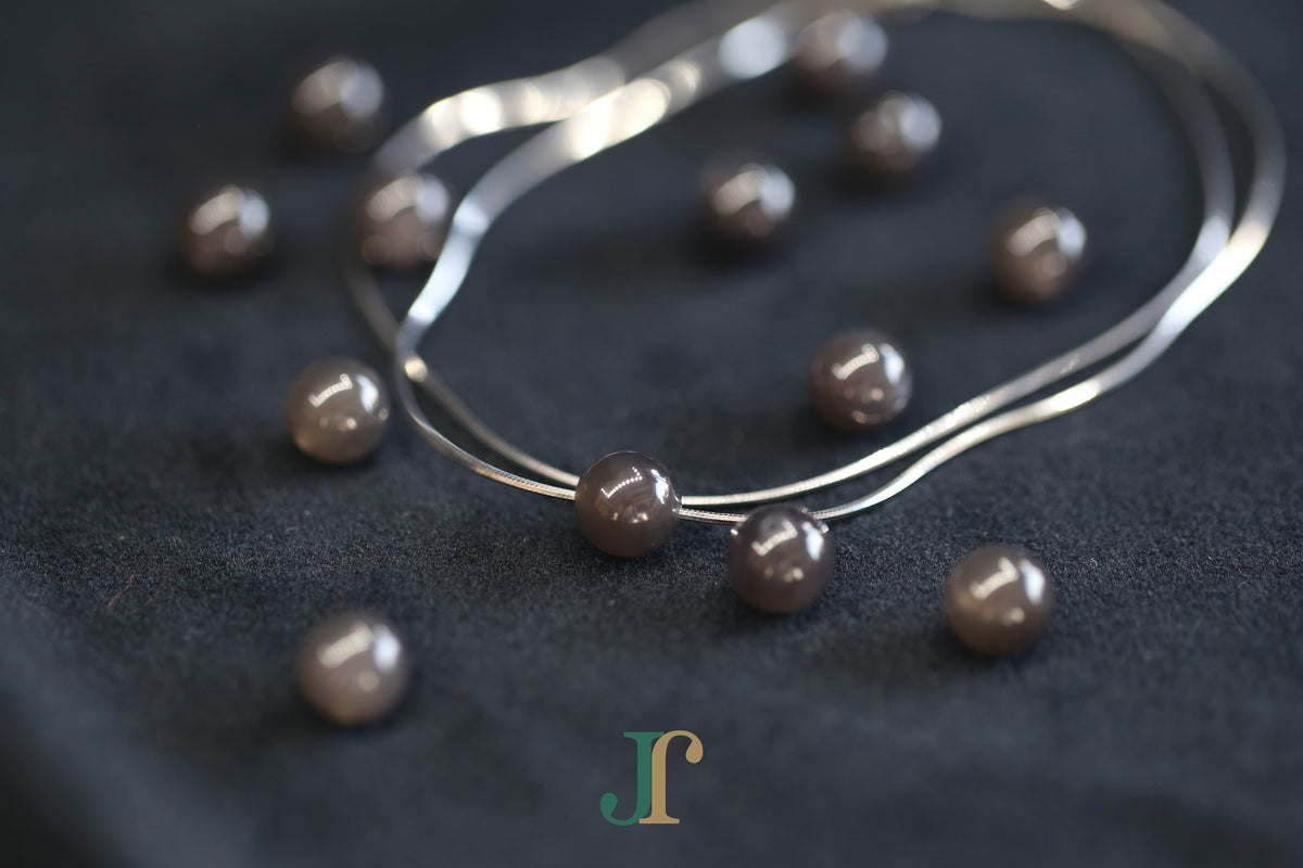 GAIA Pure 8 · Smoky Lilac — nephrite jade bead necklace, on the chain