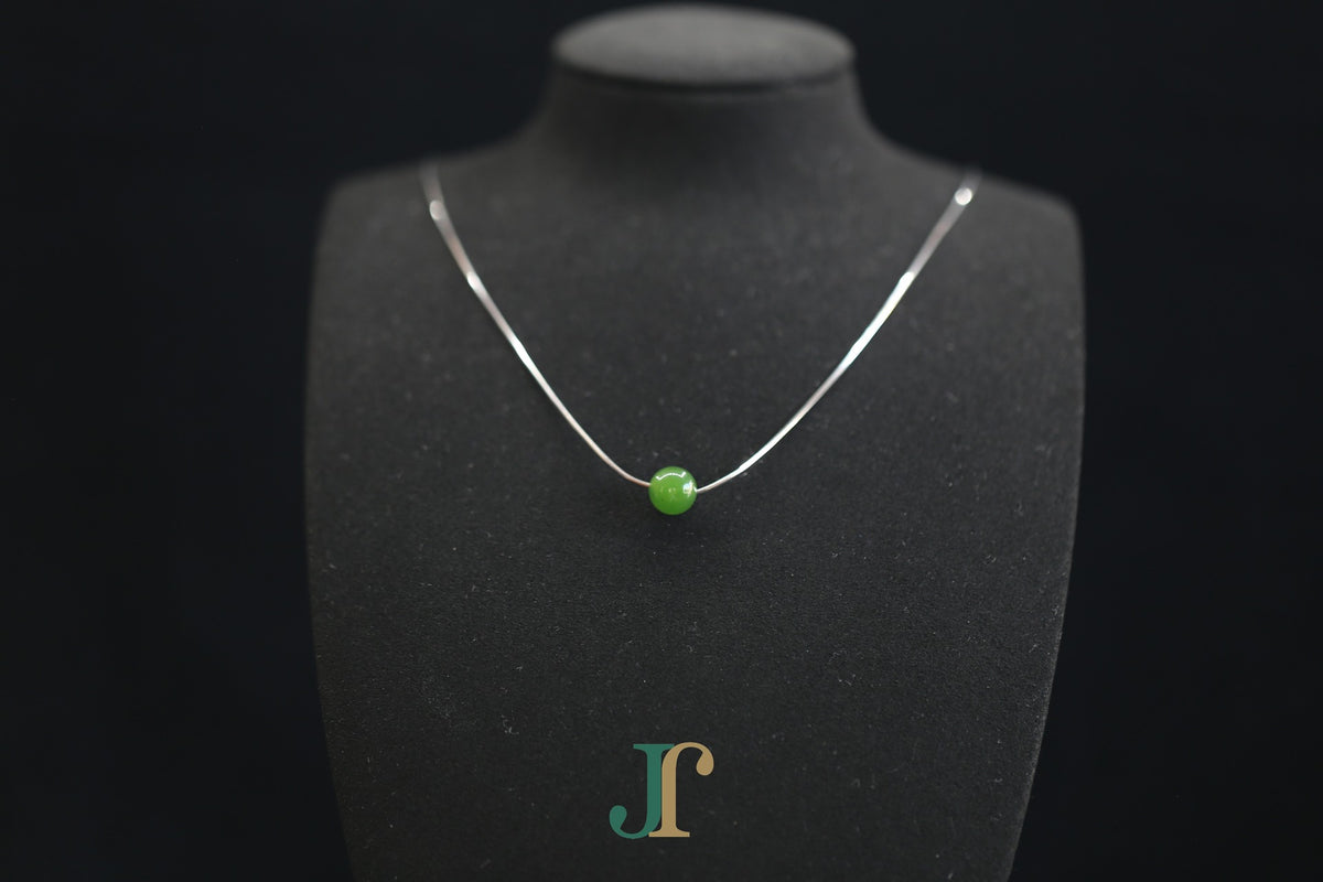 GAIA Pure 8 · Willow Green — nephrite jade bead necklace, on a display bust