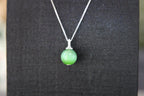 GAIA Serenity · Cat's Eye — nephrite jade pendant, on the model