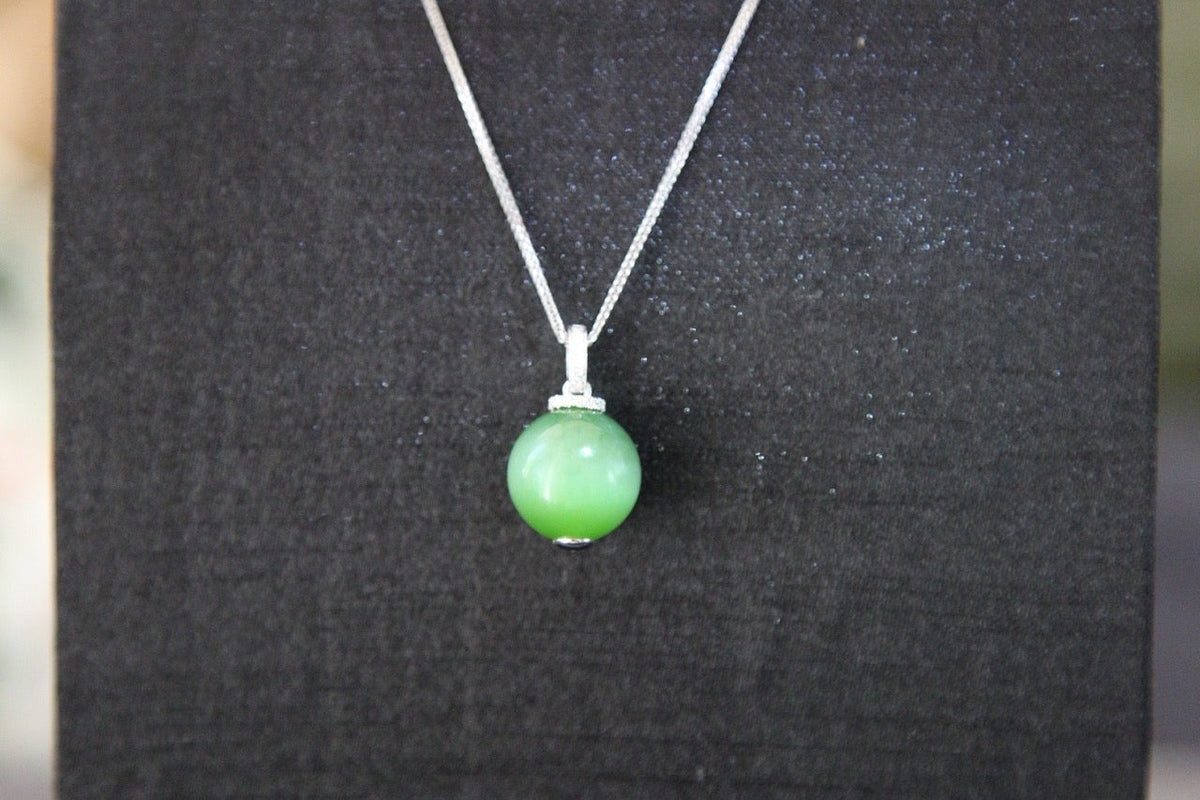 GAIA Serenity · Cat's Eye — nephrite jade pendant, on the model