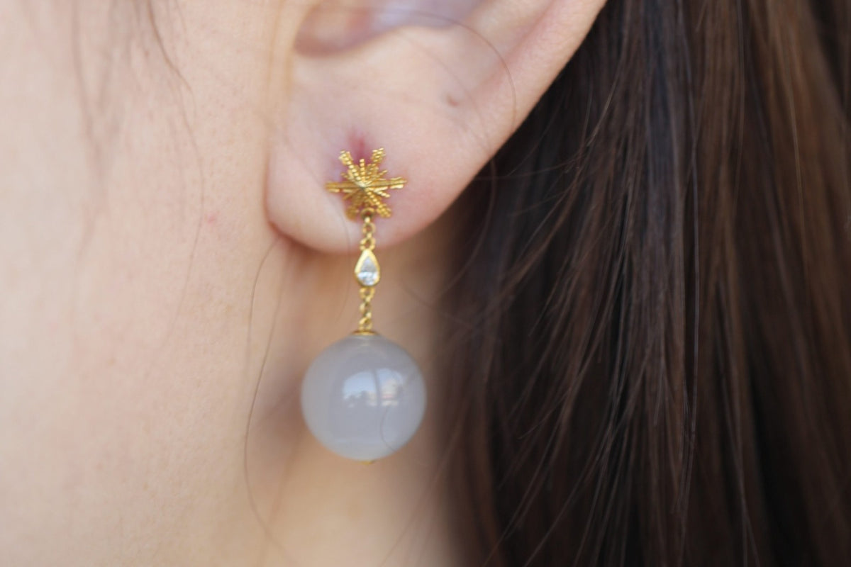 GAIA Snow 10 · Smoky Lilac — nephrite jade earrings, on the model