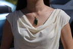 GALET 012 · Spinach Green — nephrite jade pendant, on the model