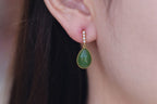 GALET 015 · Willow Green — nephrite jade earrings, on the model